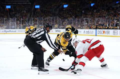 BOSTON, MASSACHUSETTS – MAY 06: David Pastrnak #88 of the Boston Bruins faces off against Sebastian Aho #20 of the Carolina Hurricanes during the first period of Game Three of the First Round of the 2022 Stanley Cup Playoffs at TD Garden on May 06, 2022, in Boston, Massachusetts. (Photo by Maddie Meyer/Getty Images)