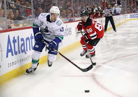 NEWARK, NEW JERSEY – OCTOBER 19: Quinn Hughes #43 of the Vancouver Canucks skates against Jack Hughes #86 of the New Jersey Devils during the third period at the Prudential Center on October 19, 2019 in Newark, New Jersey. The Devils shut out the Canucks 1-0. (Photo by Bruce Bennett/Getty Images)