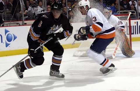 WASHINGTON – OCTOBER 13: Alexander Ovechkin #8 of the Washington Capitals spins away from defenseman Brent Sopel #3 of the New York Islanders at the MCI Center on October 13, 2005 in Washington, DC. (Photo by Greg Fiume/Getty Images)