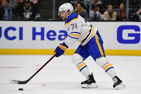 Oct 28, 2021; Anaheim, California, USA; Buffalo Sabres right wing Rasmus Asplund (74) moves the puck against the Anaheim Ducks during the overtime period at Honda Center. Mandatory Credit: Gary A. Vasquez-USA TODAY Sports