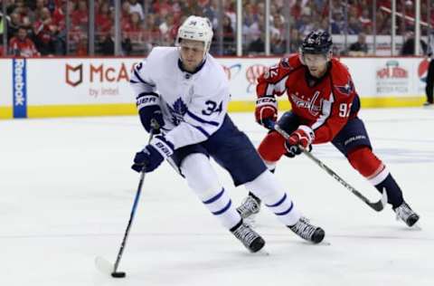 WASHINGTON, DC – APRIL 21: Auston Matthews #34 of the Toronto Maple Leafs moves the puck in front of Evgeny Kuznetsov #92 of the Washington Capitals in Game Five of the Eastern Conference First Round during the 2017 NHL Stanley Cup Playoffs at Verizon Center on April 21, 2017 in Washington, DC. (Photo by Rob Carr/Getty Images)