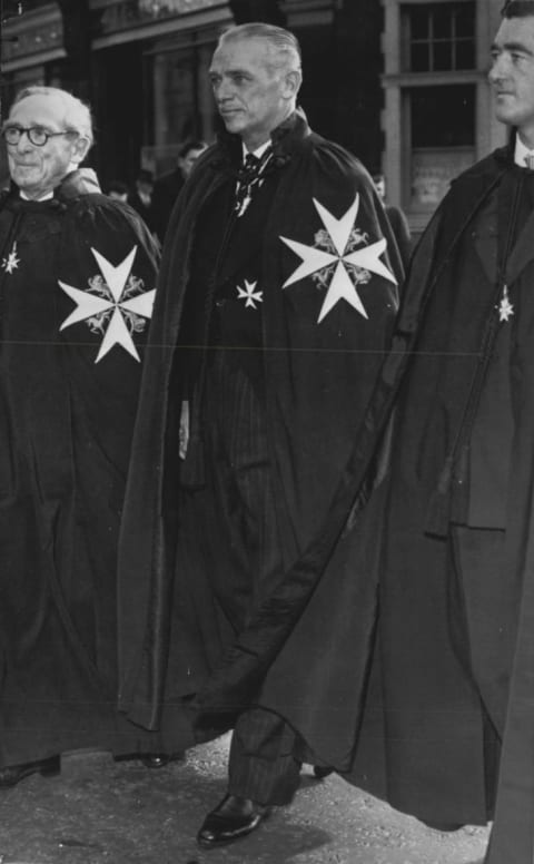 Actor Douglas Fairbanks Jr. in 1958 wearing the mantle and insignia of a Knight of Justice of the Order of St. John.