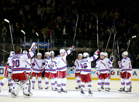 The New York Rangers salute the fans (Photo by Elsa/Getty Images)