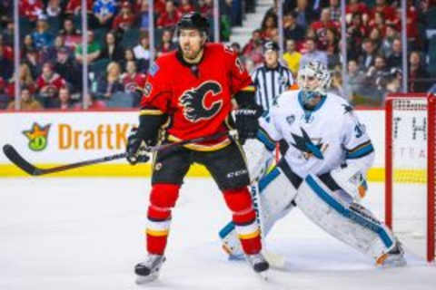 Jan 11, 2016; Calgary, Alberta, CAN; Calgary Flames right wing David Jones (19) screens in front of San Jose Sharks goalie Martin Jones (31) during the first period at Scotiabank Saddledome. San Jose Sharks won 5-4. Mandatory Credit: Sergei Belski-USA TODAY Sports