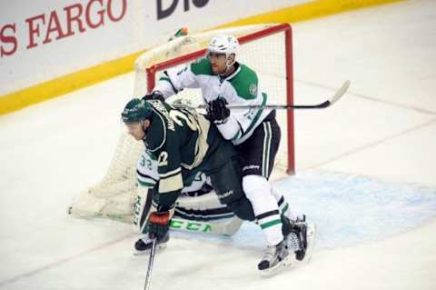 Feb 9, 2016; Saint Paul, MN, USA; Dallas Stars defenseman Patrik Nemeth (15) battles with Minnesota Wild forward Nino Niederreiter (22) for position in front of the net during the third period at Xcel Energy Center. The Stars win 4-3 over the Wild in overtime. Mandatory Credit: Marilyn Indahl-USA TODAY Sports