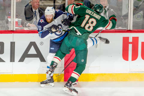 ST. PAUL, MN – APRIL 17: Jordan Greenway #18 of the Minnesota Wild checks Joe Morrow #70 of the Winnipeg Jets in Game Four of the Western Conference First Round during the 2018 NHL Stanley Cup Playoffs at the Xcel Energy Center on April 17, 2018 in St. Paul, Minnesota. (Photo by Bruce Kluckhohn/NHLI via Getty Images)