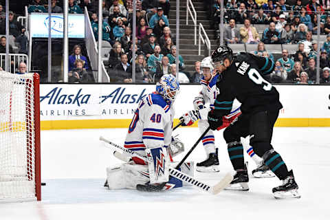 Evander Kane #9 of the San Jose Sharks takes a shot on goal against Alexandar Georgiev #40 of the New York Rangers