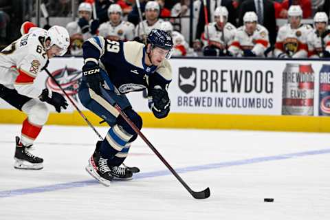 Nov 20, 2022; Columbus, Ohio, USA; Columbus Blue Jackets right wing Yegor Chinakhov (59) and Florida Panthers defenseman Brandon Montour (62) in the first period at Nationwide Arena. Mandatory Credit: Gaelen Morse-USA TODAY Sports