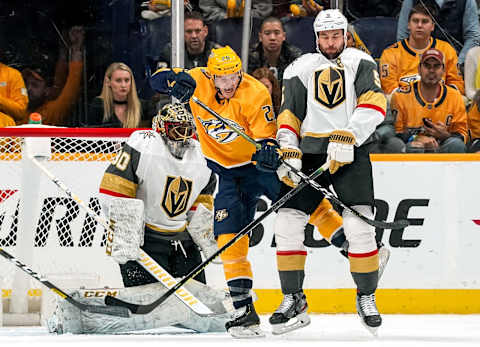 NASHVILLE, TN – NOVEMBER 27: Daniel Carr #26 of the Nashville Predators battles in front of the net against Cody Glass #9 and Malcolm Subban #30 of the Vegas Golden Knights at Bridgestone Arena on November 27, 2019 in Nashville, Tennessee. (Photo by John Russell/NHLI via Getty Images)