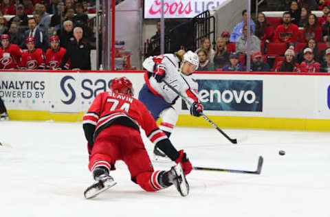 RALEIGH, NC – DECEMBER 28: Washington Capitals left wing Carl Hagelin (62) shoots the puck while Carolina Hurricanes defenseman Jaccob Slavin (74) tries to stop it during the 1st half of the Carolina Hurricanes game versus the Washington Capitals on December 28th, 2019 at PNC Arena in Raleigh, NC (Photo by Jaylynn Nash/Icon Sportswire via Getty Images)