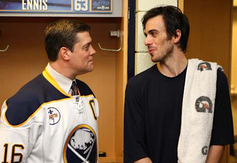 Apr 8, 2011; Buffalo, NY, USA; Buffalo Sabres goalie Ryan Miller (right) talks to former player Pat LaFontaine (left) in the locker room after a game against the Philadelphia Flyers at HSBC Arena. Mandatory Credit: Timothy T. Ludwig-USA TODAY Sports