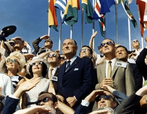 Vice President Spiro Agnew and former President Lyndon Johnson view the liftoff of Apollo 11 from the stands located at the Kennedy Space Center VIP viewing site.