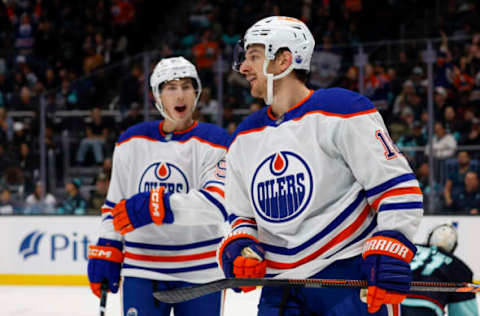 Nov 11, 2023; Seattle, Washington, USA; Edmonton Oilers left wing Zach Hyman (18) celebrates after scoring his second goal of the first period against the Seattle Kraken at Climate Pledge Arena. Mandatory Credit: Joe Nicholson-USA TODAY Sports