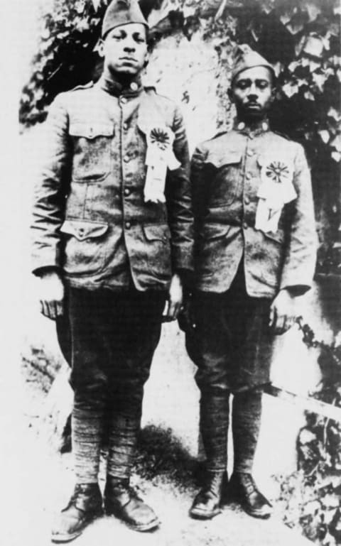 Needham Roberts (L) and William Henry Johnson (R) pose for a photo with their Croix de Guerre medals in 1918.