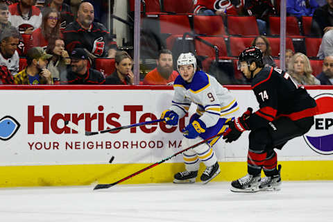 RALEIGH, NC – DECEMBER 02: Zach Benson #9 of the Buffalo Sabres skates with the puck guarded by Jaccob Slavin #74 of the Carolina Hurricanes during the first period of the game at PNC Arena on December 02, 2023 in Raleigh, North Carolina. (Photo by Jaylynn Nash/Getty Images)