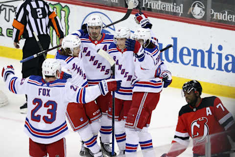 Mika Zibanejad #93 of the New York Rangers (R) celebrates his game winning goal on the powerplay at 17:00 of the third period against the New Jersey Devils and is joined by Artemi Panarin #10, Chris Kreider #20 and Ryan Strome #16 . (Photo by Bruce Bennett/Getty Images)