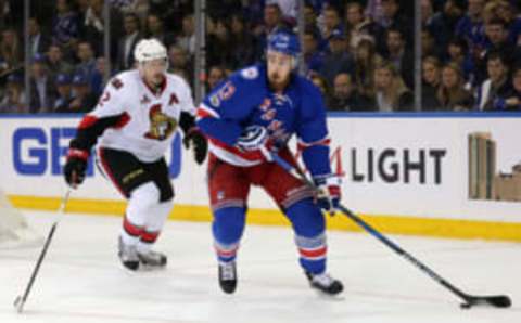 May 9, 2017; New York, NY, USA; New York Rangers right wing Kevin Hayes (13) skates with the puck as Ottawa Senators defenseman Dion Phaneuf (2) chases during the second period of game six of the second round of the 2017 Stanley Cup Playoffs at Madison Square Garden. Mandatory Credit: Brad Penner-USA TODAY Sports