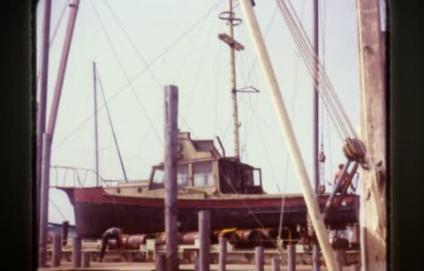 The Orca II is seen out of the water. The barrels used to sink and raise it are visible underneath.