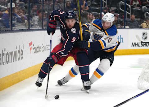 COLUMBUS, OHIO – OCTOBER 02: Ivan Provorov #9 of the Columbus Blue Jackets and Oskar Sundqvist #70 of the St. Louis Blues battle for the puck during the third period of a preseason game at Nationwide Arena on October 02, 2023 in Columbus, Ohio. (Photo by Jason Mowry/Getty Images)