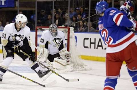 Mar 27, 2016; New York, NY, USA; New York Rangers center Eric Staal (12) shoots and scores a goal past Pittsburgh Penguins goalie Marc-Andre Fleury (29) during the second period at Madison Square Garden. Mandatory Credit: Adam Hunger-USA TODAY Sports