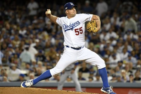 Oct 20, 2016; Los Angeles, CA, USA; Los Angeles Dodgers relief pitcher Joe Blanton (55) delivers a pitch in the sixth inning against the Chicago Cubs in game five of the 2016 NLCS playoff baseball series against the Los Angeles Dodgers at Dodger Stadium. Mandatory Credit: Richard Mackson-USA TODAY Sports