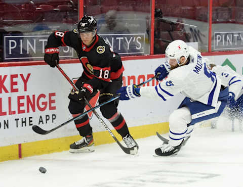 OTTAWA, ON – JANUARY 15: Tim Stützle #18 of the Ottawa Senators battles for a loose puck against Jake Muzzin #8 of the Toronto Maple Leafs at Canadian Tire Centre on January 15, 2021 in Ottawa, Ontario, Canada. (Photo by Matt Zambonin/Freestyle Photography/Getty Images)