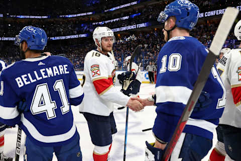 TAMPA, FL – MAY 23: Aleksander Barkov #16 of the Florida Panthers shakes hands with Corey Perry #10 of the Tampa Bay Lightning after Game Four of the Second Round of the 2022 Stanley Cup Playoffs at Amalie Arena on May 23, 2022 in Tampa, Florida. (Photo by Mike Carlson/Getty Images)