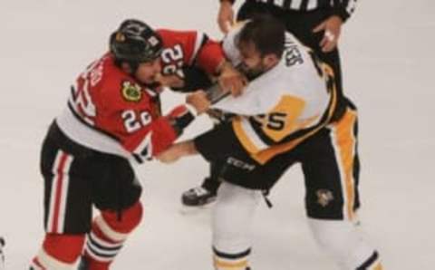 NHL All-Star Game Fan Vote: Chicago Blackhawks forward Jordin TooToo (22) and Pittsburgh Penguins forward Tom Sestito (25) fight in the first period of their preseason game at the United Center. Mandatory Credit: Matt Marton-USA TODAY Sports