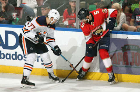 SUNRISE, FL – MARCH 17: Aaron Ekblad #5 of the Florida Panthers and Oscar Klefbom #77 of the Edmonton Oilers battle along the boards for control of the puck at the BB&T Center on March 17, 2018 in Sunrise, Florida. The Oilers defeated the Panthers 4-2. (Photo by Joel Auerbach/Getty Images) *** Local Caption *** Oscar Klefbom;Aaron Ekblad