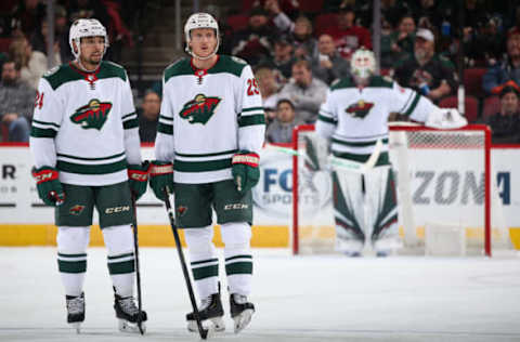 GLENDALE, ARIZONA – DECEMBER 19: Matt Dumba #24 and Jonas Brodin #25 of the Minnesota Wild during the third period of the NHL game against the Arizona Coyotes at Gila River Arena on December 19, 2019, in Glendale, Arizona. The Wild defeated the Coyotes 8-5. (Photo by Christian Petersen/Getty Images)