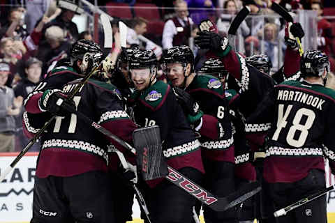 Nov 25, 2016; Glendale, AZ, USA; Arizona Coyotes goalie Mike Smith (41) and right wing Shane Doan (19) celebrate with teammates after beating the Edmonton Oilers 3-2 in a shootout at Gila River Arena. Mandatory Credit: Matt Kartozian-USA TODAY Sports