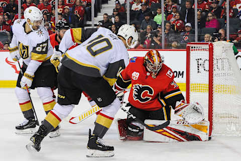 CALGARY, AB – MARCH 8: David Rittich #33 of the Calgary Flames stops the shot of Nicolas Roy #10 of the Vegas Golden Knights during an NHL game at Scotiabank Saddledome on March 8, 2020 in Calgary, Alberta, Canada. (Photo by Derek Leung/Getty Images)