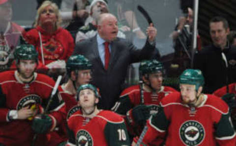 Feb 18, 2017; Saint Paul, MN, USA; Minnesota Wild head coach Bruce Boudreau (C) reacts from behind the bench after a play against the Nashville Predators during the third period at Xcel Energy Center. The Wild won 5-2. Mandatory Credit: Marilyn Indahl-USA TODAY Sports