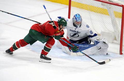 Feb 10, 2017; Saint Paul, MN, USA; Minnesota Wild forward Mikael Granlund (64) tries to put the puck in the corner of the net on Tampa Bay Lightning goalie Andrei Vasilevskiy (88) during overtime at Xcel Energy Center. The Wild win 2-1 over the Lightning in a shootout. Mandatory Credit: Marilyn Indahl-USA TODAY Sports