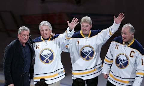 Feb 23, 2011; Buffalo, NY, USA; New Buffalo Sabres owner Terry Pegula is introduced to the fans along with alumni players Rene Robert (14) , Rick Martin (7) and Gilbert Perreault (11) before a game against the Atlanta Thrashers at HSBC Arena. Mandatory Credit: Timothy T. Ludwig-USA TODAY Sports