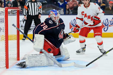 Jan 7, 2023; Columbus, Ohio, USA; Columbus Blue Jackets goaltender Joonas Korpisalo (70) makes a save in net against the Carolina Hurricanes in the first period at Nationwide Arena. Mandatory Credit: Aaron Doster-USA TODAY Sports