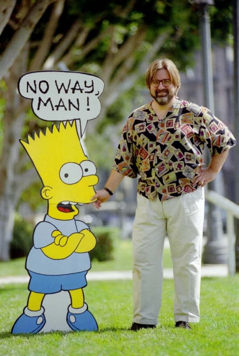 'The Simpsons' creator Matt Groening stands next to a cardboard cutout of Bart Simpson in 1992.