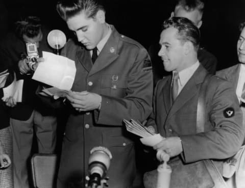 Elvis Presley receiving mail while in the Army, 1958