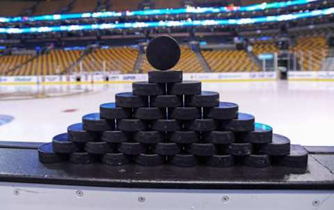 Jan 3, 2015; Boston, MA, USA; A detail view of practice pucks on the boards prior to a game between the Boston Bruins and the Ottawa Senators at TD Banknorth Garden. Mandatory Credit: Bob DeChiara-USA TODAY Sports