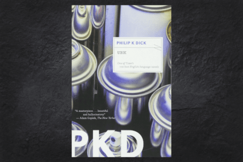 The cover of the book Ubik on a black background.