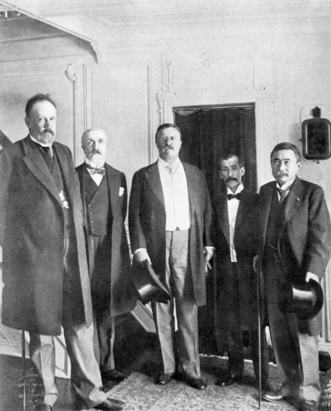 Roosevelt stands between Russian and Japanese dignitaries in Portsmouth, New Hampshire, in 1905. On September 5, they signed the Treaty of Portsmouth, ending the Russo-Japanese War and earning Roosevelt the 1906 Nobel Peace Prize; he was the first American to win a Nobel Prize of any kind.