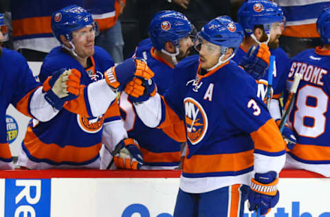 Mar 18, 2017; Brooklyn, NY, USA; New York Islanders defenseman Travis Hamonic (3) is congratulated by his teammates after scoring a goal against the Columbus Blue Jackets during the first period at Barclays Center. Mandatory Credit: Andy Marlin-USA TODAY Sports