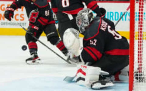 Mar 25, 2023; Raleigh, North Carolina, USA; Carolina Hurricanes goaltender Pyotr Kochetkov (52) makes a save against the Toronto Maple Leafs during the second period at PNC Arena. Mandatory Credit: James Guillory-USA TODAY Sports