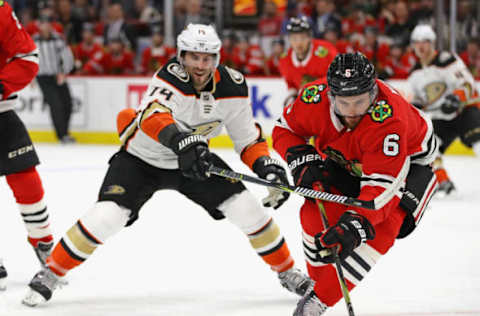 CHICAGO, IL: Michal Kempny #6 of the Chicago Blackhawks controls the puck under pressure from Adam Henrique #14 of the Anaheim Ducks on February 15, 2018. (Photo by Jonathan Daniel/Getty Images)