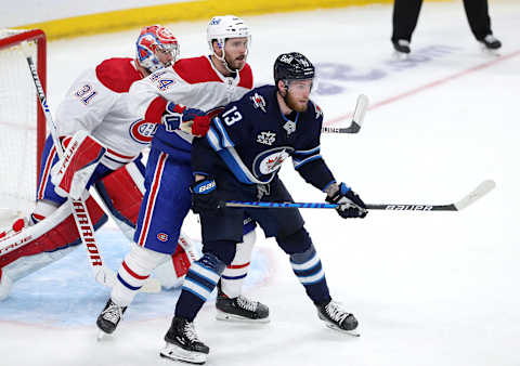 WINNIPEG, MANITOBA – JUNE 04: Pierre-Luc Dubois #13 of the Winnipeg Jets jockeys for space in front of Joel Edmundson #44 and Carey Price #31 of the Montreal Canadiens in Game Two of the Second Round of the 2021 Stanley Cup Playoffs on June 4, 2021 at Bell MTS Place in Winnipeg, Manitoba, Canada. (Photo by Jason Halstead/Getty Images)