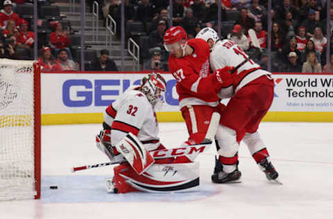 DETROIT, MICHIGAN – MARCH 01: Carter Rowney #37 of the Detroit Red Wings scores a second-period goal past Antti Raanta #32 of the Carolina Hurricanes at Little Caesars Arena on March 01, 2022, in Detroit, Michigan. (Photo by Gregory Shamus/Getty Images)