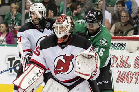 Nov 15, 2016; Dallas, TX, USA; New Jersey Devils right wing Kyle Palmieri (21) and goalie Cory Schneider (35) defends against Dallas Stars center Gemel Smith (46) during the second period at the American Airlines Center. Mandatory Credit: Jerome Miron-USA TODAY Sports