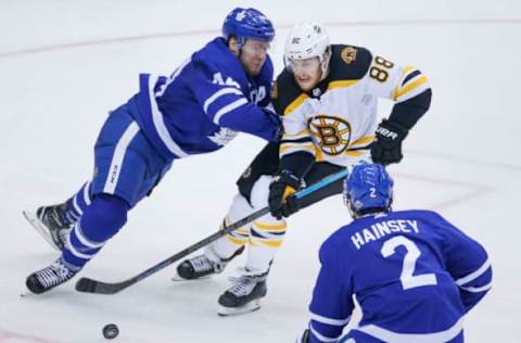 TORONTO, ON – APRIL 19: Toronto Maple Leafs defenseman Morgan Rielly (44) is having none of Boston Bruins right wing David Pastrnak (88) attempt to get fancy, and continues to play the man. Toronto Maple Leafs VS Boston Bruins during 2nd period action in Game 4 of Round 1, of NHL playoffs at the Air Canada Centre. Toronto Star/Rick Madonik (Rick Madonik/Toronto Star via Getty Images)