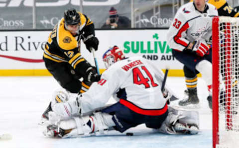 Apr 11, 2021; Boston, Massachusetts, USA; Boston Bruins center Craig Smith (12) scores a goal past Washington Capitals goalie Vitek Vanecek (41) during the third period at TD Garden. Mandatory Credit: Paul Rutherford-USA TODAY Sports