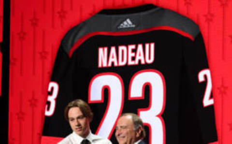 Jun 28, 2023; Nashville, Tennessee, USA; Carolina Hurricanes draft pick Bradly Nadeau shakes hands with NHL commissioner Gary Bettman after being selected with the thirtieth pick in round one of the 2023 NHL Draft at Bridgestone Arena. Mandatory Credit: Christopher Hanewinckel-USA TODAY Sports